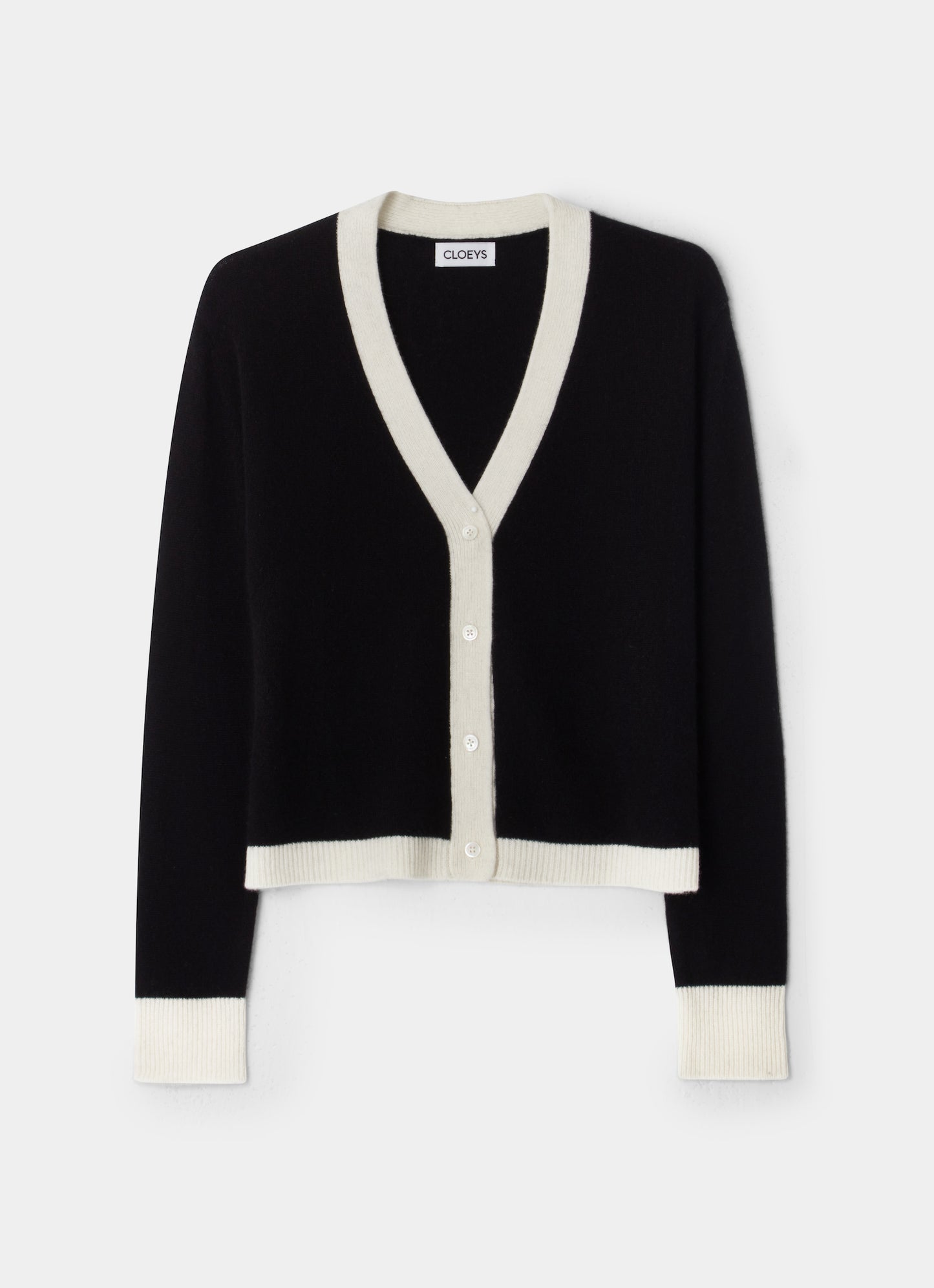 A colourblock cardigan in black and white in soft cashmere front